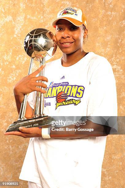 Le'coe Willingham of the Phoenix Mercury poses with the WNBA Championship Trophy after defeating the Indiana Fever 94-86 in Game Five of the WNBA...