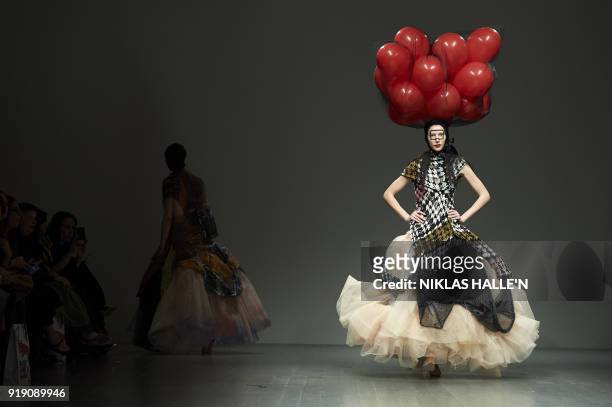 Models present creations from the Matty Bovan collection during their catwalk show on the first day of London Fashion Week Autumn/Winter 2018 in...