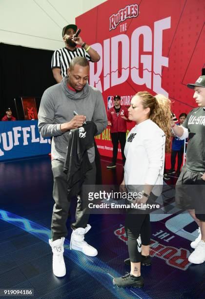 Former NBA Star Paul Pierce give tips to fans on how to shoot from The RIDGE at the Ruffles footprint in Los Angeles during NBA All-Star...