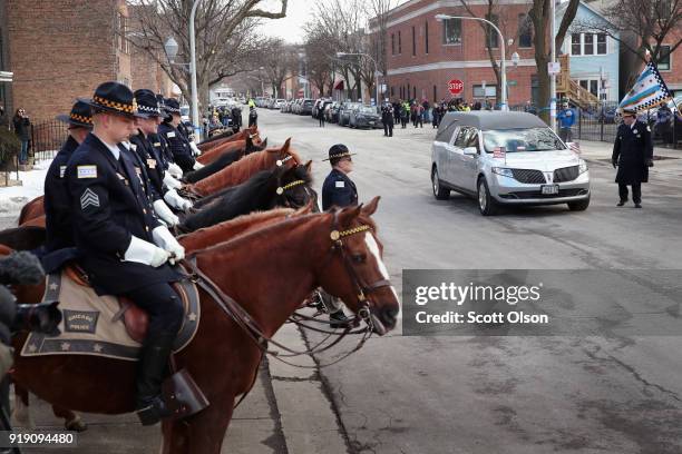 The remains of Police Commander Paul Bauer arrive at the Nativity of Our Lord church in the Bridgeport neighborhood for his wake on February 16, 2018...