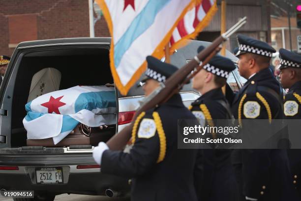 Draped with a city of Chicago plag, the remains of Police Commander Paul Bauer arrive at the Nativity of Our Lord church in the Bridgeport...