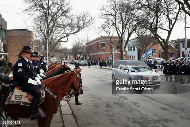 The remains of Police Commander Paul Bauer arrive at the Nativity of Our Lord church in the Bridgeport neighborhood for his wake on February 16, 2018...