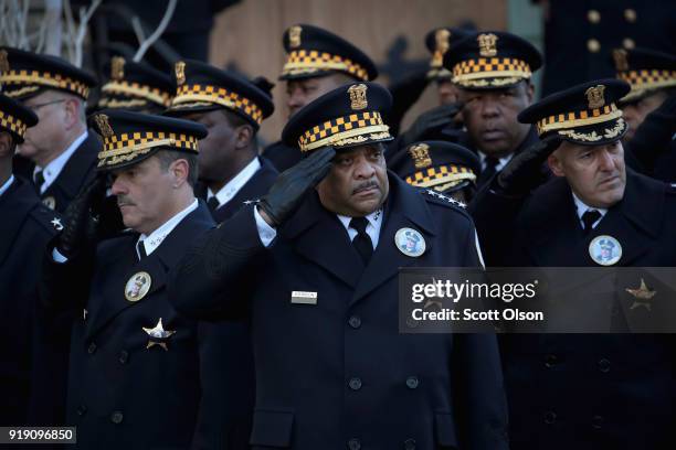 Chicago Police Superintendent Eddie Johnson salutes as the remains of Commander Paul Bauer are carried into the Nativity of Our Lord church in the...