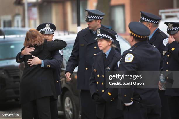Chicago police stand outside of the Nativity of Our Lord church in the Bridgeport neighborhood to honor Commander Paul Bauer as his remains are...