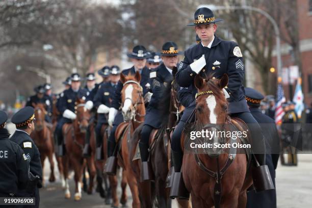 Chicago mounted police await the remains of Commander Paul Bauer outside of the Nativity of Our Lord church in the Bridgeport neighborhood on...