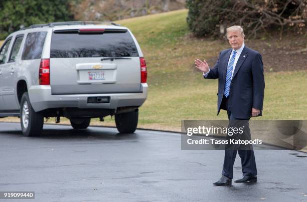 President Donald Trump walks from the Oval Office to the Marine One helicopter as they depart from the South Lawn of the White House on February 16,...