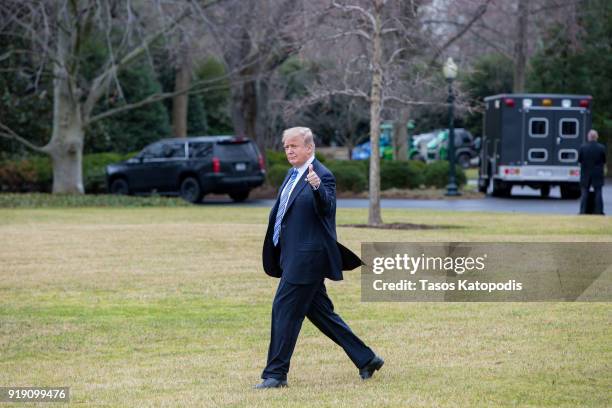 President Donald Trump walks from the Oval Office to the Marine One helicopter as they depart from the South Lawn of the White House on February 16,...