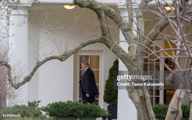 President Donald Trump walks from the Oval Office to the Marine One helicopter as they depart from the South Lawn of the White House on February 16,...