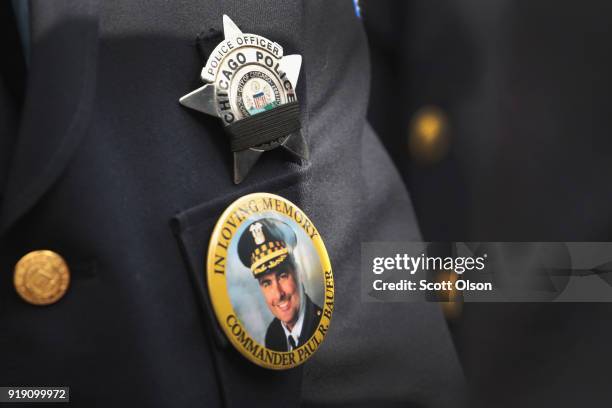 Chicago police stand outside of the Nativity of Our Lord church in the Bridgeport neighborhood to honor Commander Paul Bauer as his remains are...