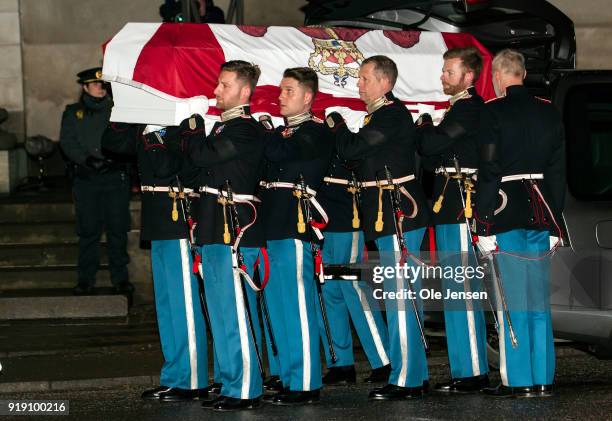 Soldiers from the Royal Guard carry the coffin of deceased Prince Henrik of Denmark into the Parliament's church on February 16, 2018 in Copenhagen,...