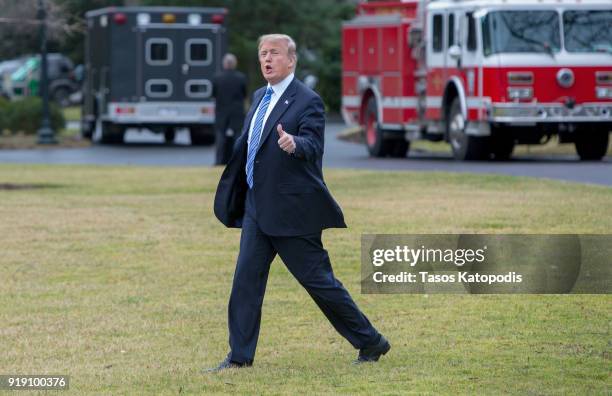 President Donald Trump walks from the Oval Office to the Marine One helicopter as they depart from the South Lawn of the White House on February 16,...