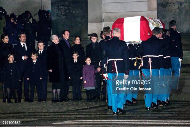 The Royal family watch as soldiers from the Royal Guard carry the coffin of deceased Prince Henrik of Denmark into the Parliament's church on...