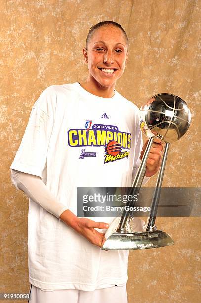 Diana Taurasi of the Phoenix Mercury poses with the WNBA Championship Trophy after defeating the Indiana Fever 94-86 in Game Five of the WNBA Finals...