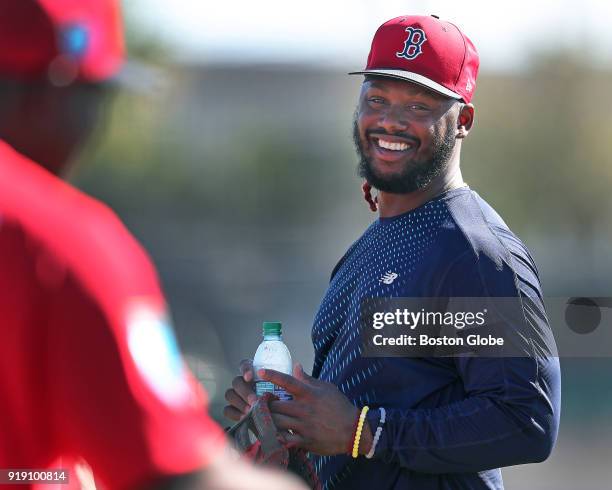 Boston Red Sox player Hanley Ramirez holds a bottle of water during his first day of spring training for the year at the Player Development Complex...