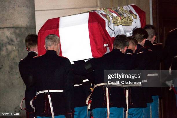 Soldiers from the Royal Guard carry the coffin of deceased Prince Henrik of Denmark into the Parliament's church on February 16, 2018 in Copenhagen,...