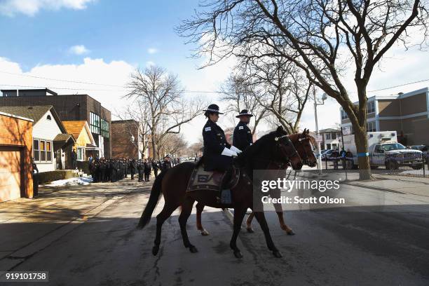 Chicago mounted police honor Commander Paul Bauer as his remains are carried into the Nativity of Our Lord church in the Bridgeport neighborhood on...