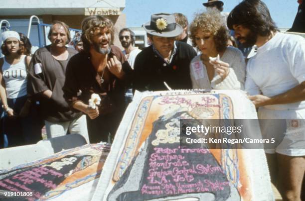 Actors Barbra Streisand, Kris Kristopherson, Bill Graham and producer Jon Peters are photographed on the set of 'A Star is Born' in 1976 at Sun Devil...