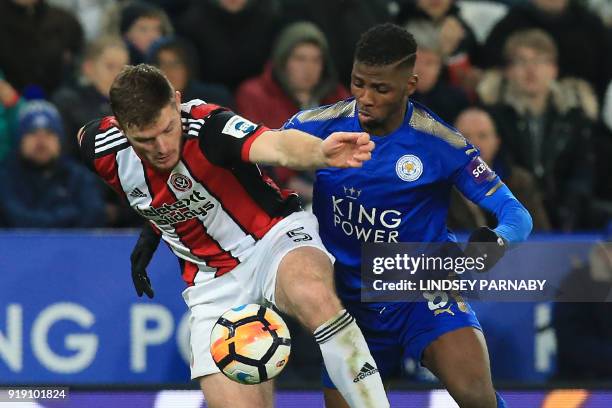 Sheffield United's English defender Jack O'Connell vies with Leicester City's Nigerian striker Kelechi Iheanacho during the English FA Cup fifth...