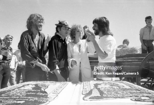 Actors Barbra Streisand, Kris Kristopherson, Bill Graham and producer Jon Peters are photographed on the set of 'A Star is Born' in 1976 at Sun Devil...