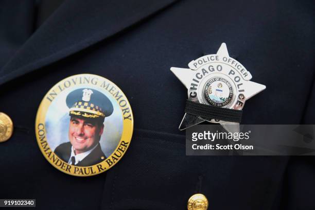 Chicago police stand outside of the Nativity of Our Lord church in the Bridgeport neighborhood to honor Commander Paul Bauer as his remains are...
