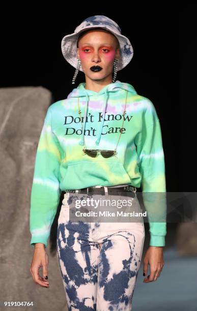 Model walks the runway at the Ashley Williams show during London Fashion Week February 2018 at University of Westminster on February 16, 2018 in...