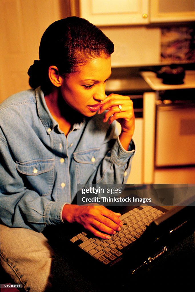 Young woman working on laptop computer