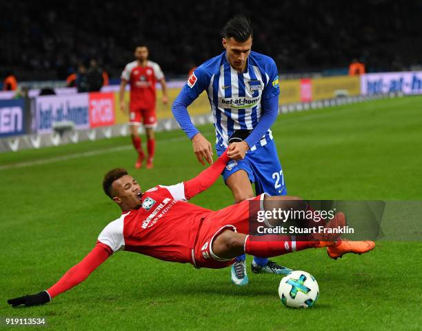 Davie Selke of Berlin is challenged by Jean-Philippe Gbamin of Mainz during the Bundesliga match between Hertha BSC and 1. FSV Mainz 05 at...