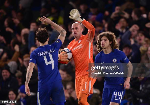 Willy Caballero of Chelsea is congratulated by Cesc Fabregas and Ethan Ampadu during the Emirates FA Cup Fifth Round match between Chelsea and Hull...