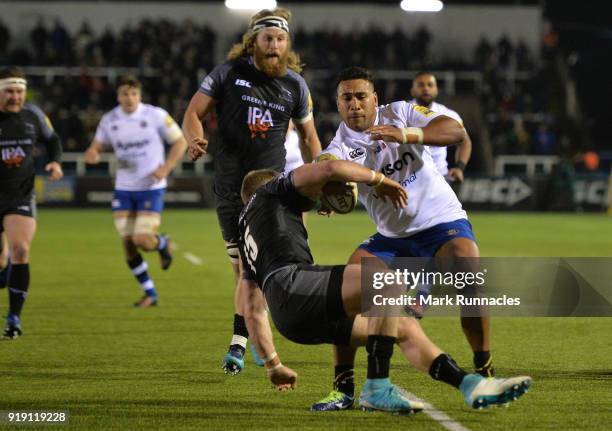 Cooper Vuna of Bath Rugby is tackled by Alex Tait of Newcastle Falcons during the Aviva Premiership match between Newcastle Falcons and Bath Rugby at...