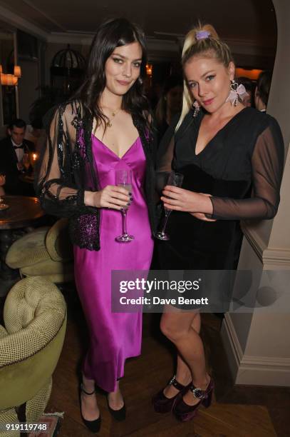 Amber Anderson and Bella Howard attend Grey Goose Vodka and GQ Style's dinner in celebration of film and fashion at Kettner's on February 16, 2018 in...