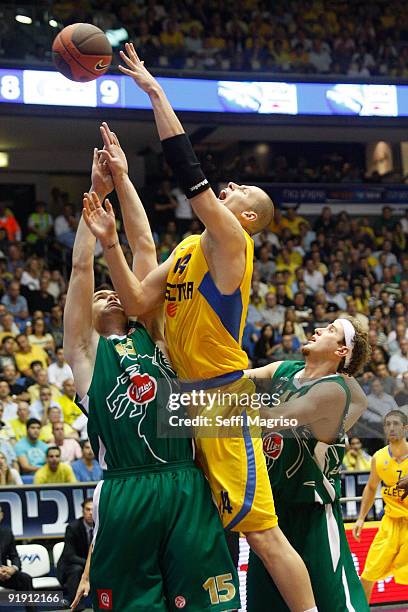 Maciej Lampe, #14 of Maccabi Electra competes with Uros Slokar, #15 of Union Olimpija in action during the Euroleague Basketball 2009-2010 Opening...