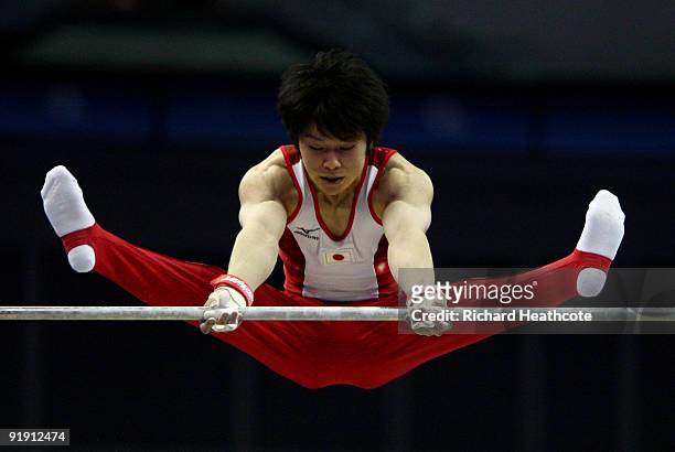 Kohei Uchimura of Japan competes in the parallel bars during the Men's All Round Final on the third day of the Artistic Gymnastics World...