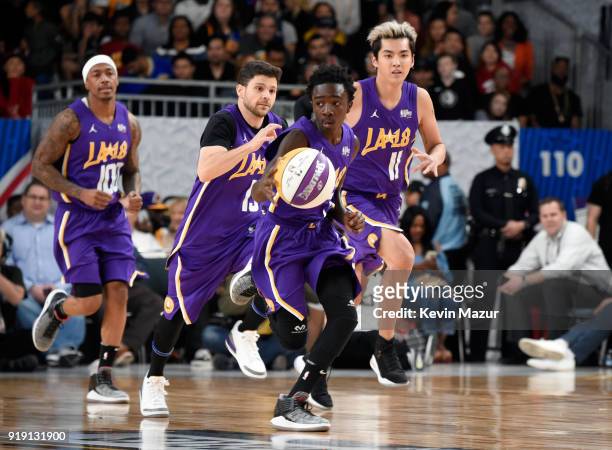 Actor/recording artist Nick Cannon, actors Jerry Ferrara, Caleb McLaughlin, and Kris Wu run down the court during the NBA All-Star Celebrity Game...