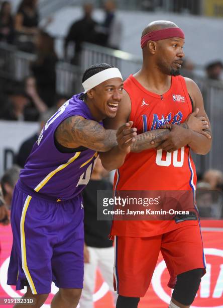 Nick Cannon and Jamie Foxx vie for position during the 2018 NBA All-Star Game Celebrity Game at Los Angeles Convention Center on February 16, 2018 in...