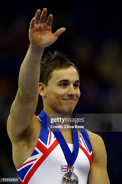 Daniel Keatings of Great Britain smiles after he won silver in the Men's All Round Final on the third day of the Artistic Gymnastics World...