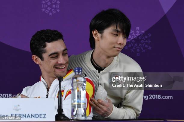 Javier Fernandez of Spain and Yuzuru Hanyu of Japan attend a press conference after competing in the Men's Single Skating Short Program on day seven...