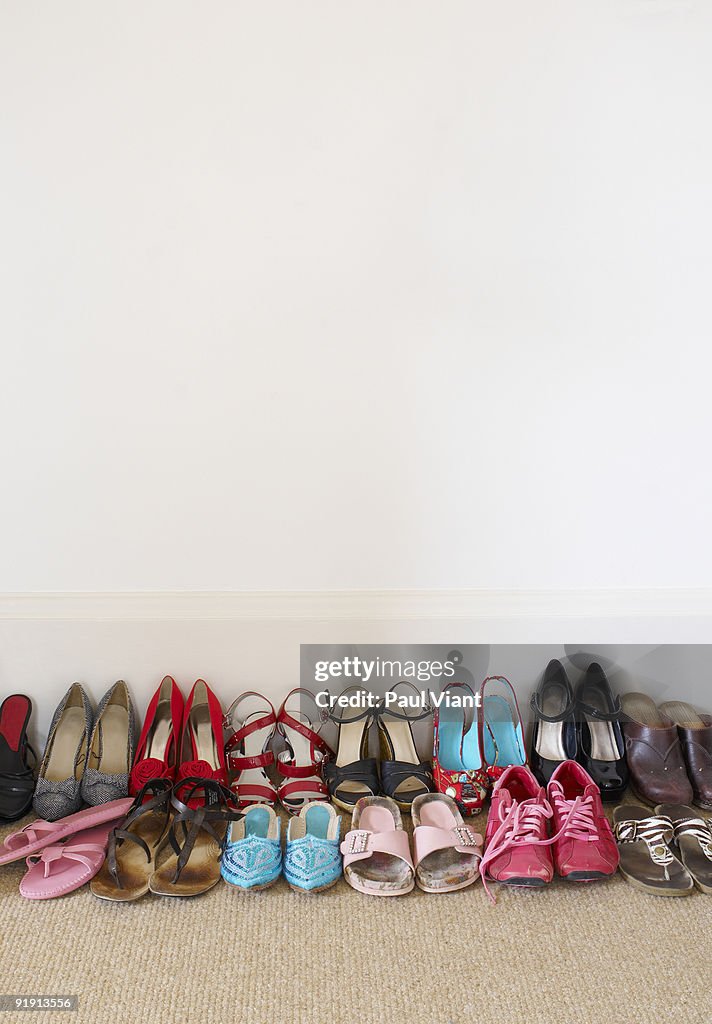 Rows of ladies shoes on floor