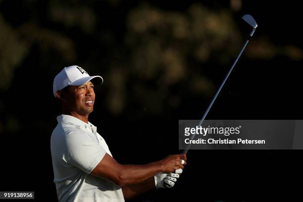Tiger Woods plays his shot from the 16th tee during the second round of the Genesis Open at Riviera Country Club on February 16, 2018 in Pacific...
