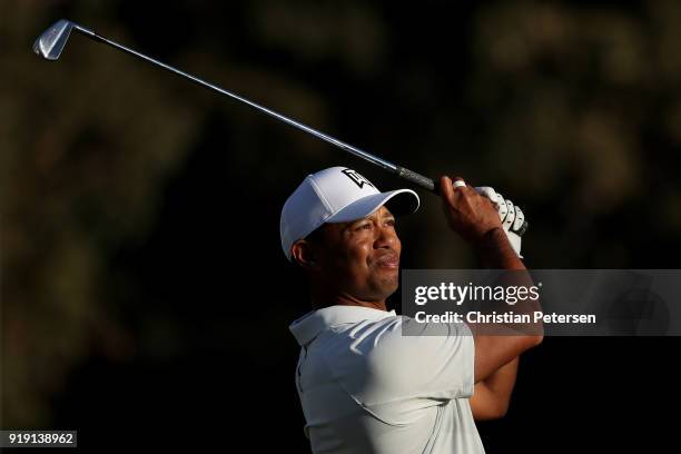 Tiger Woods plays his shot from the 16th tee during the second round of the Genesis Open at Riviera Country Club on February 16, 2018 in Pacific...