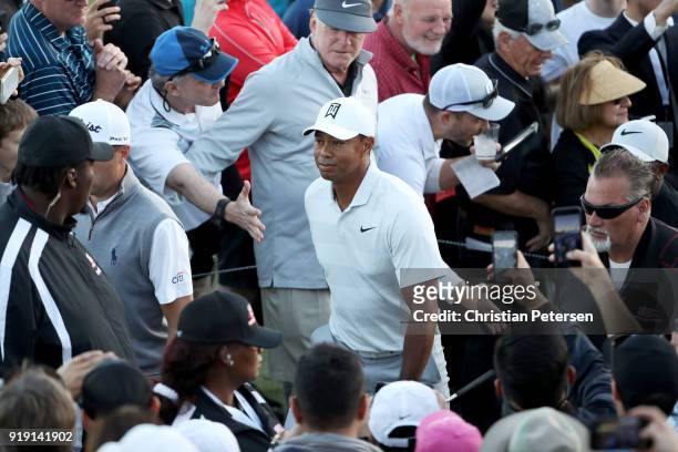 Tiger Woods walks off the course after finishing his round during the second round of the Genesis Open at Riviera Country Club on February 16, 2018...