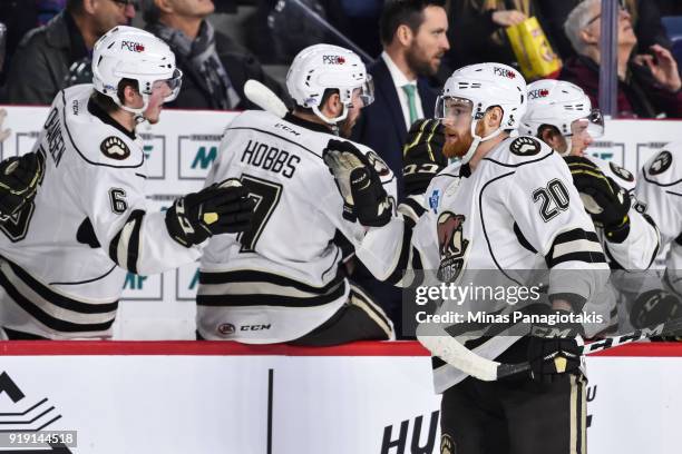 Liam O'Brien of the Hershey Bears celebrates a first period goal with teammates on the bench against the Laval Rocket during the AHL game at Place...