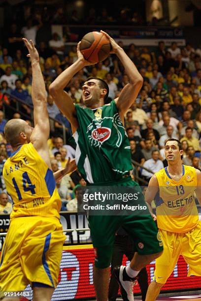 Edin Bavcic, #9 of Union Olimpija competes with Maciej Lampe, #14 of Maccabi Electra in action during the Euroleague Basketball 2009-2010 Opening...