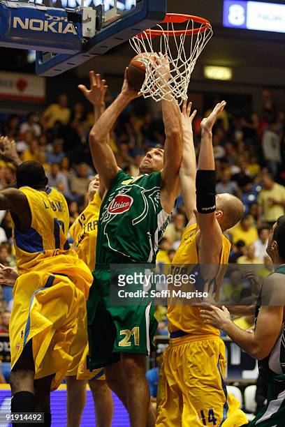 Vladimir Golubovic, #21 of Union Olimpija competes with Maciej Lampe, #14 of Maccabi Electra in action during the Euroleague Basketball 2009-2010...