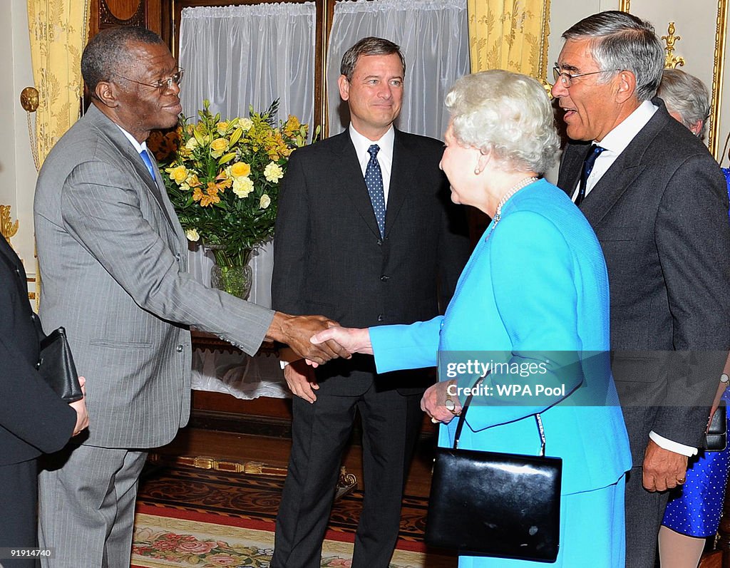 Queen Elizabeth II Is Introduced To Chief Justice Pius Langa By The queen-elizabeth-ii-is-introduced-to-chief-justice-pius-langa-by-the