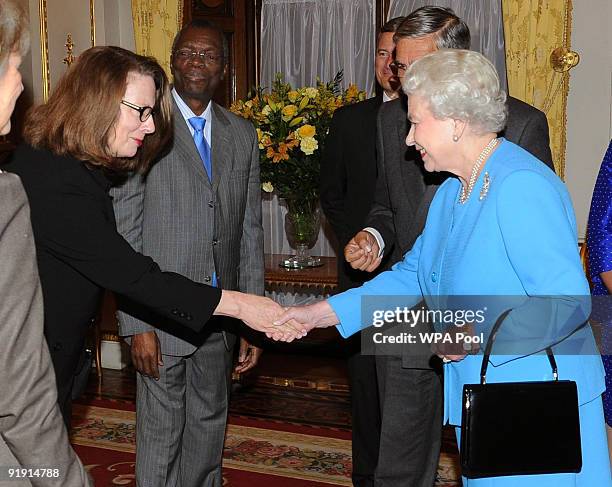 Queen Elizabeth II is introduced to Her Honour Justice Susan Kiefel during a reception for Overseas Chief Justices at Buckingham Palace on October 15...