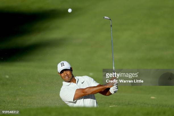 Tiger Woods plays his shot on the 14th hole during the second round of the Genesis Open at Riviera Country Club on February 16, 2018 in Pacific...
