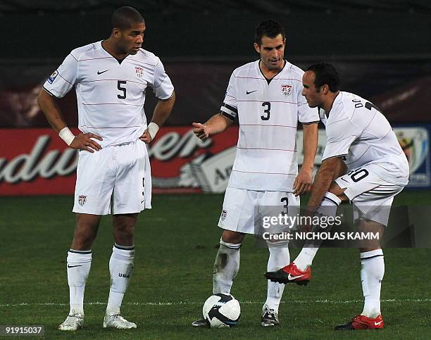 Captain Carlos Bocanegra chats with teammates Landon Donovan and Oguchi Onyewu during a 2010 World Cup qualifier against Costa Rica at RFK Stadium in...