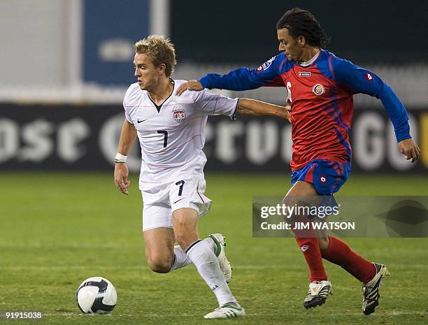 Stuart Holden of the US vies for the ball with Michael Barrantes of Costa Rica during US v Costa Rica World Cup Qualifing match in Washington, DC,...