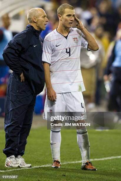 Head coach Bob Bradley speaks with Michael Bradley of the US during US v Costa Rica World Cup Qualifing match in Washington, DC, October 14, 2009....