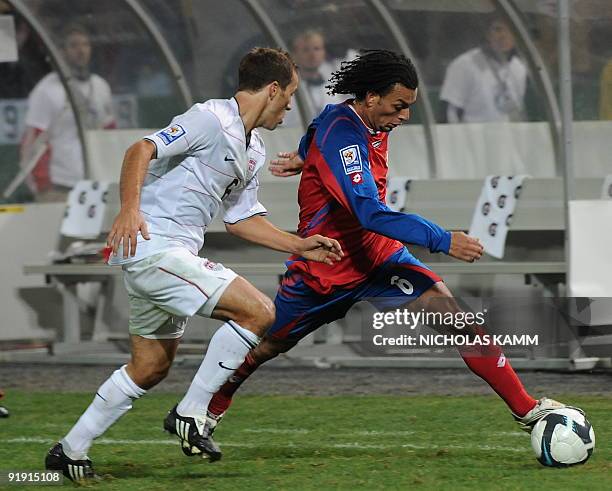 Costa Rican midfielder Michael Barrantes vies with Steve Cherundolo of the US during a 2010 World Cup qualifier at RFK Stadium in Washington on...